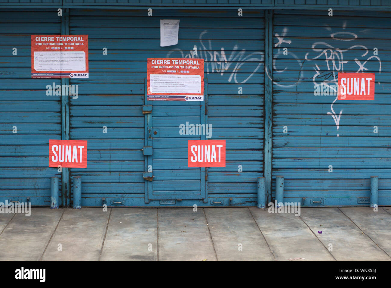 LIMA, PERU - SEPTEMBER 22, 2011: A shop closed by the SUNAT (National Supervision of Tributary Administration, Peru) for tributary infraction Stock Photo