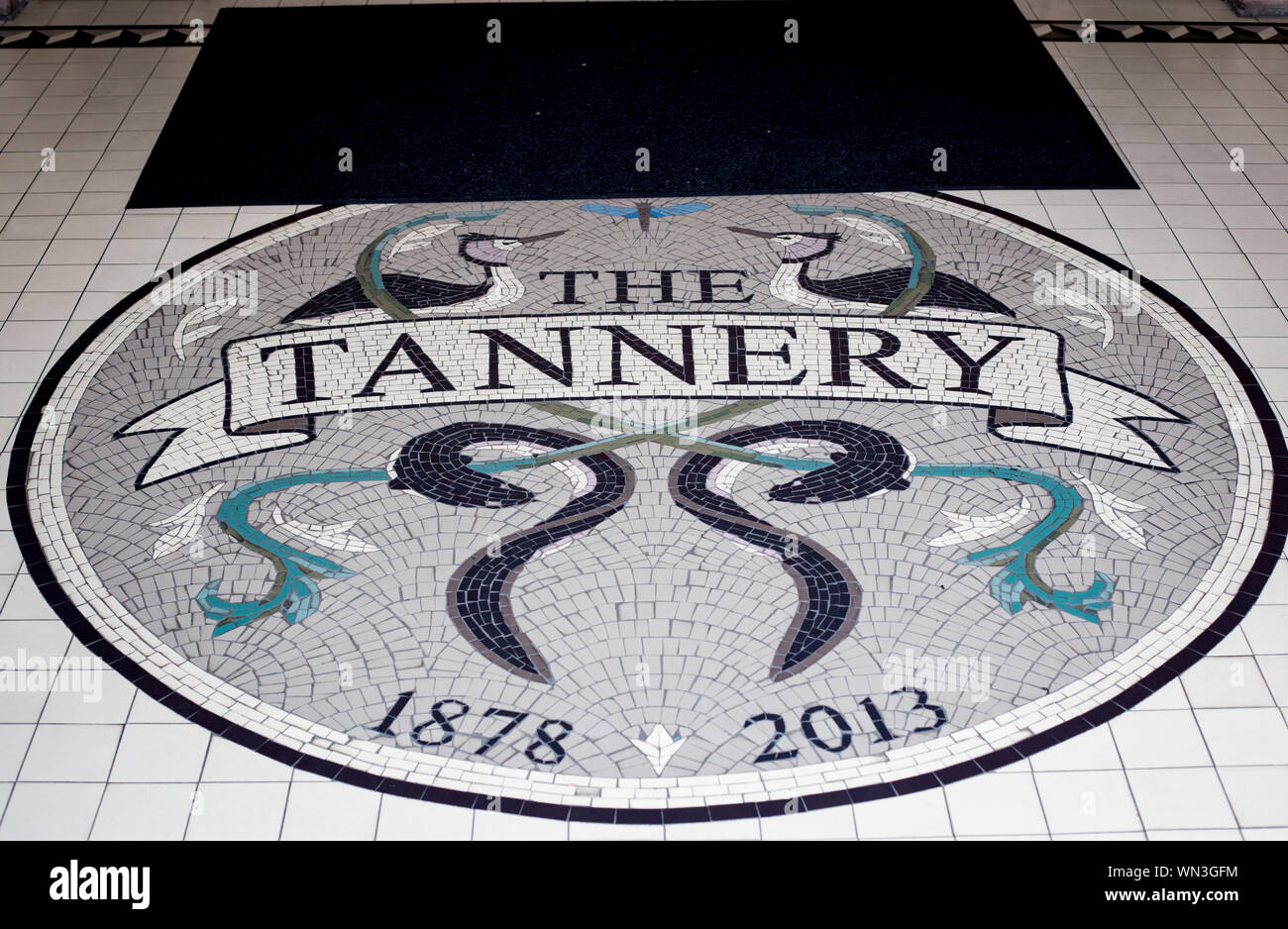 Woolston, Christchurch, New Zealand, September 2 2019: The mosaic floor tiles at one of the entrance doors to The Tannery boutique shopping centre Stock Photo