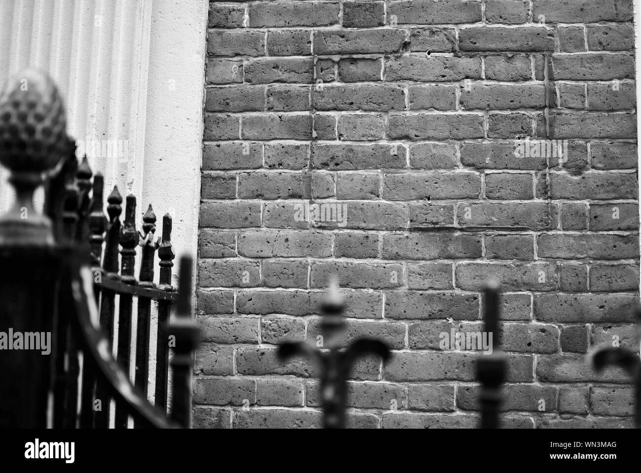 Gate Against Brick Wall Stock Photo Alamy