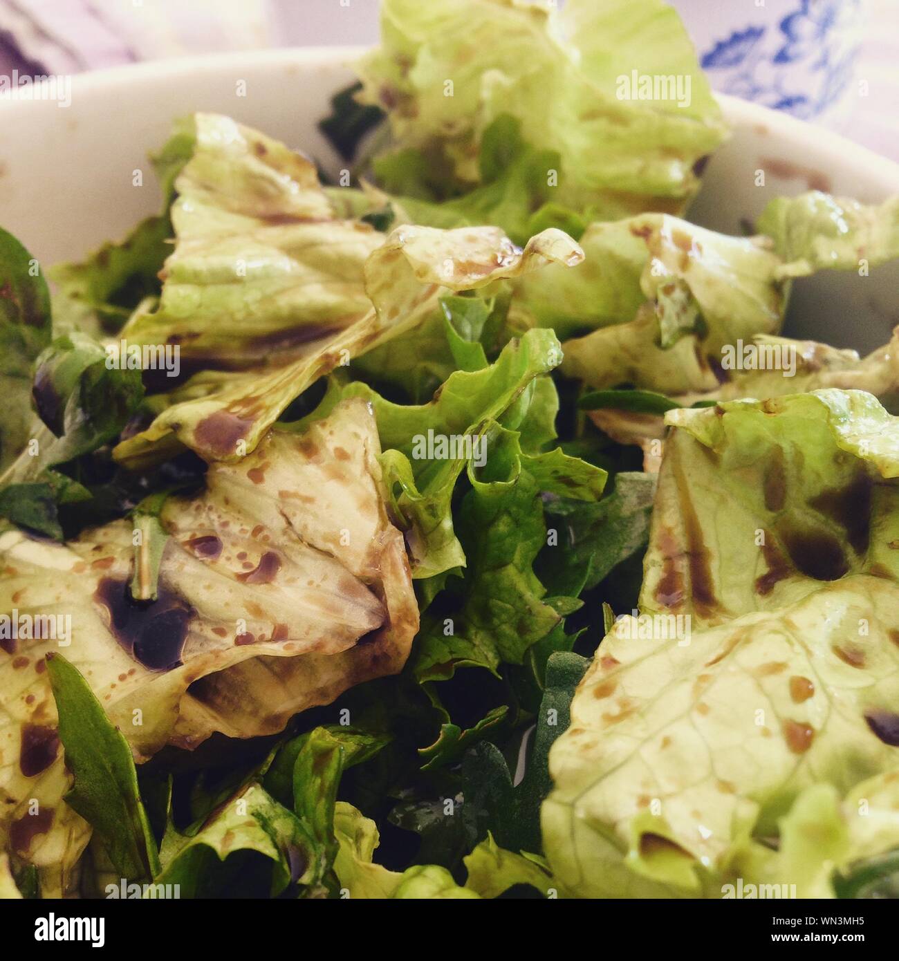 Close-up Of Salad With Balsamic Vinegar In Bowl Stock Photo