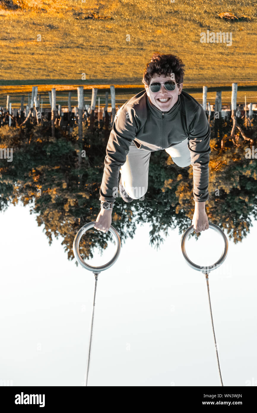 Man hanging upside down from hi-res stock photography and images - Alamy
