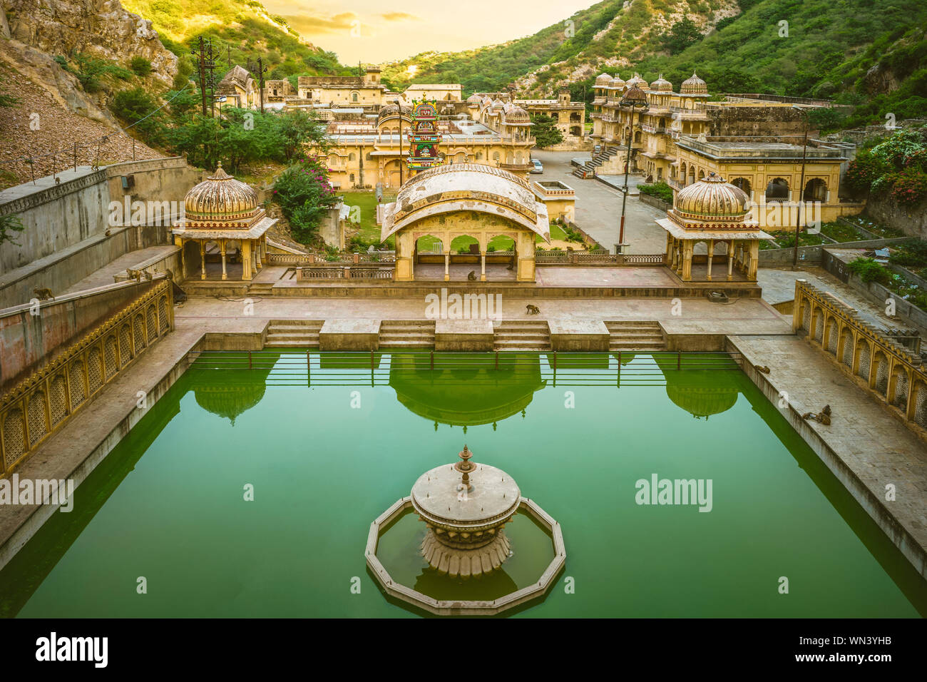 Monkey temple (galtaji) with pilgrims bathe in Jaipur, India. Stock Photo