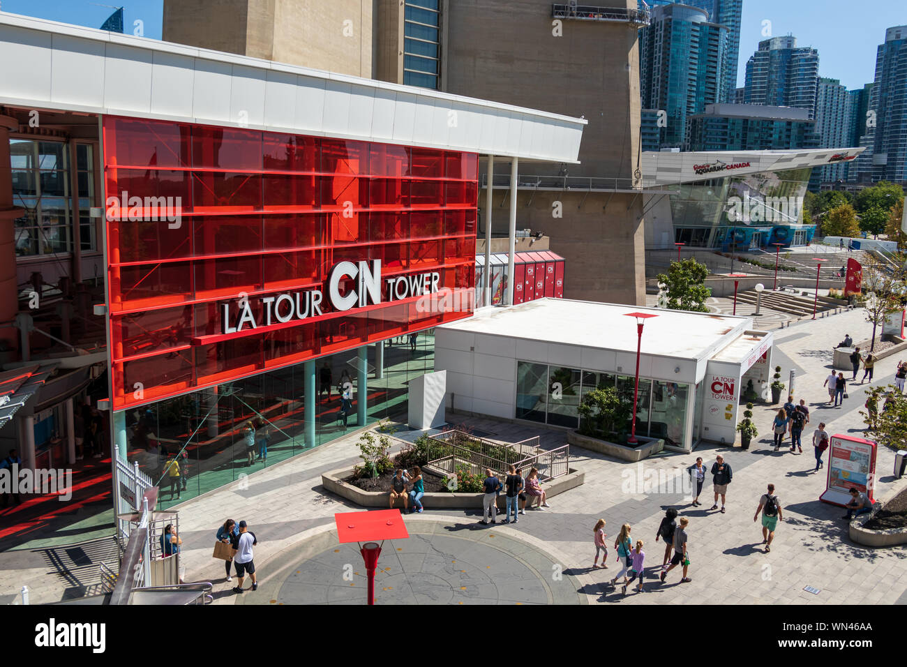 Entrance to the CN Tower on a busy day with Ripley's Aquarium of Canada
