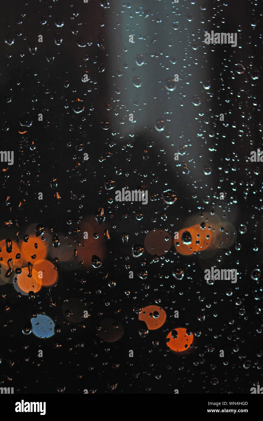 City through rainy window at night hi-res stock photography and images ...