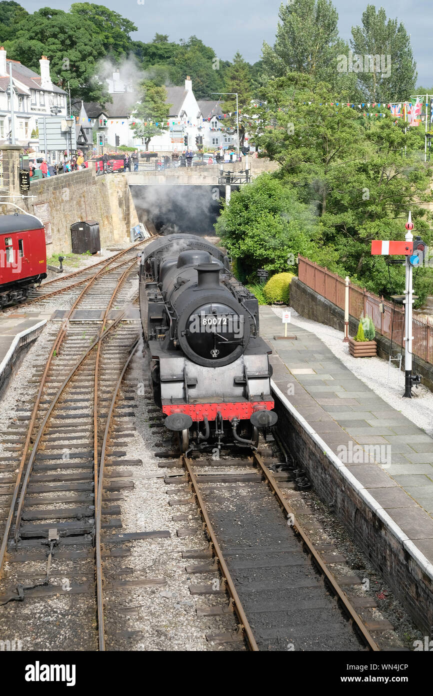 High Angle View Of Steam Train At Railroad Station Platform Stock Photo