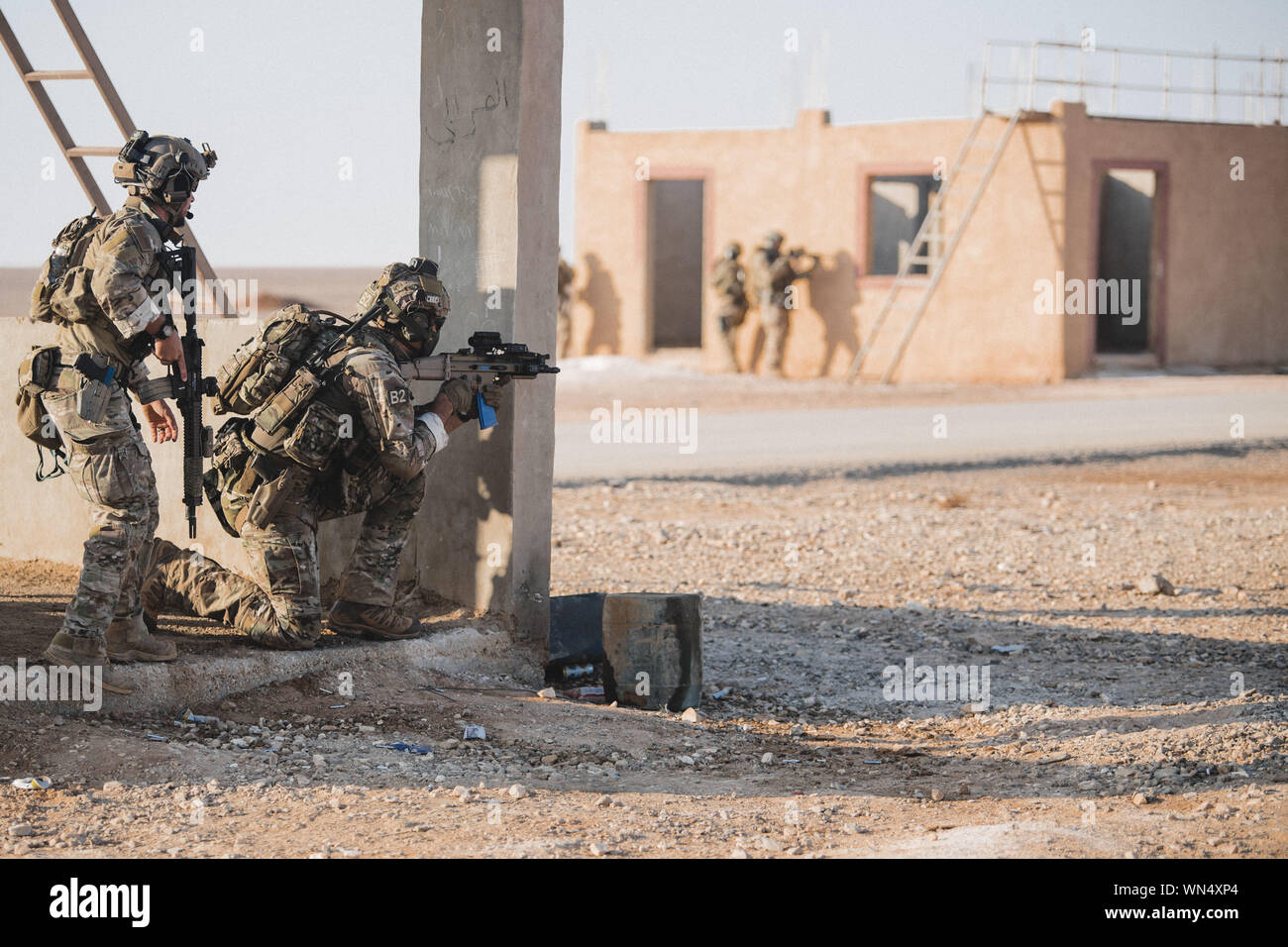 A U.S. Air Force Special Tactics Operator leads Cypriot National Guard Special Forces Operators towards an objective while conducting a training mission during Exercise Eager Lion 2019 near the Sahab District, Hashemite Kingdom of Jordan, Sept. 3, 2019. Eager Lion, U.S. Central Command's largest and most complex exercise, is an opportunity to integrate forces in a multilateral environment, operate in realistic terrain and strengthen military-to-military relationships. (U.S. Air Force photo by Senior Airman Sean Campbell) Stock Photo