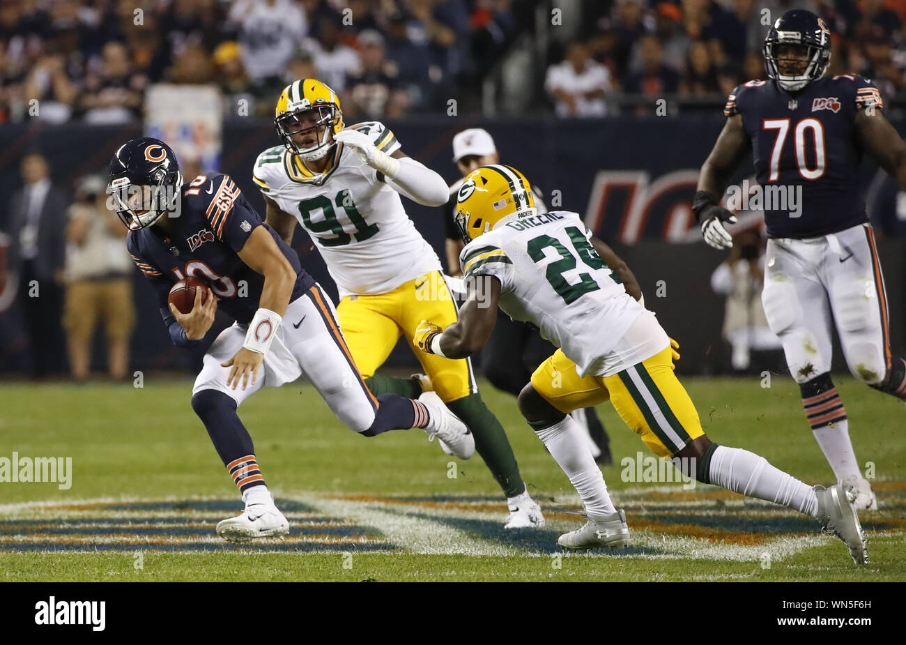 Chicago, United States. 05th Sep, 2019. Chicago Bears quarterback Mitchell Trubisky (10) rushes with the ball against Green Bay Packers safety Raven Greene (24) during the first half of an NFL game at Soldier Field in Chicago on Thursday, September 5, 2019. Photo by Kamil Krzaczynski/UPI Credit: UPI/Alamy Live News Stock Photo
