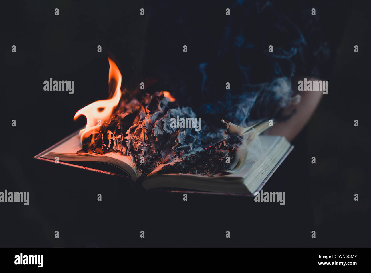Burning Book Against Black Background Stock Photo Alamy