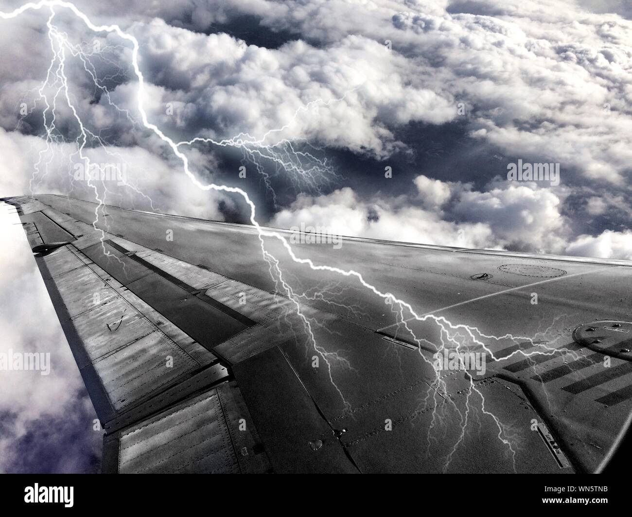 Lightning Strikes On Airplane Wing Stock Photo