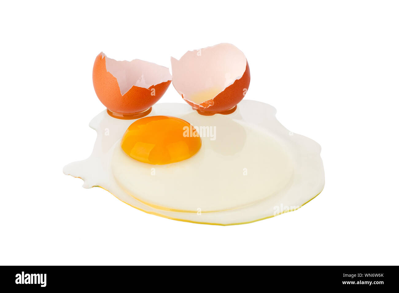Broken brown egg on white background isolated close up, cracked eggshell  and liquid egg with yellow yolk, two halves of egg shell macro Stock Photo  - Alamy
