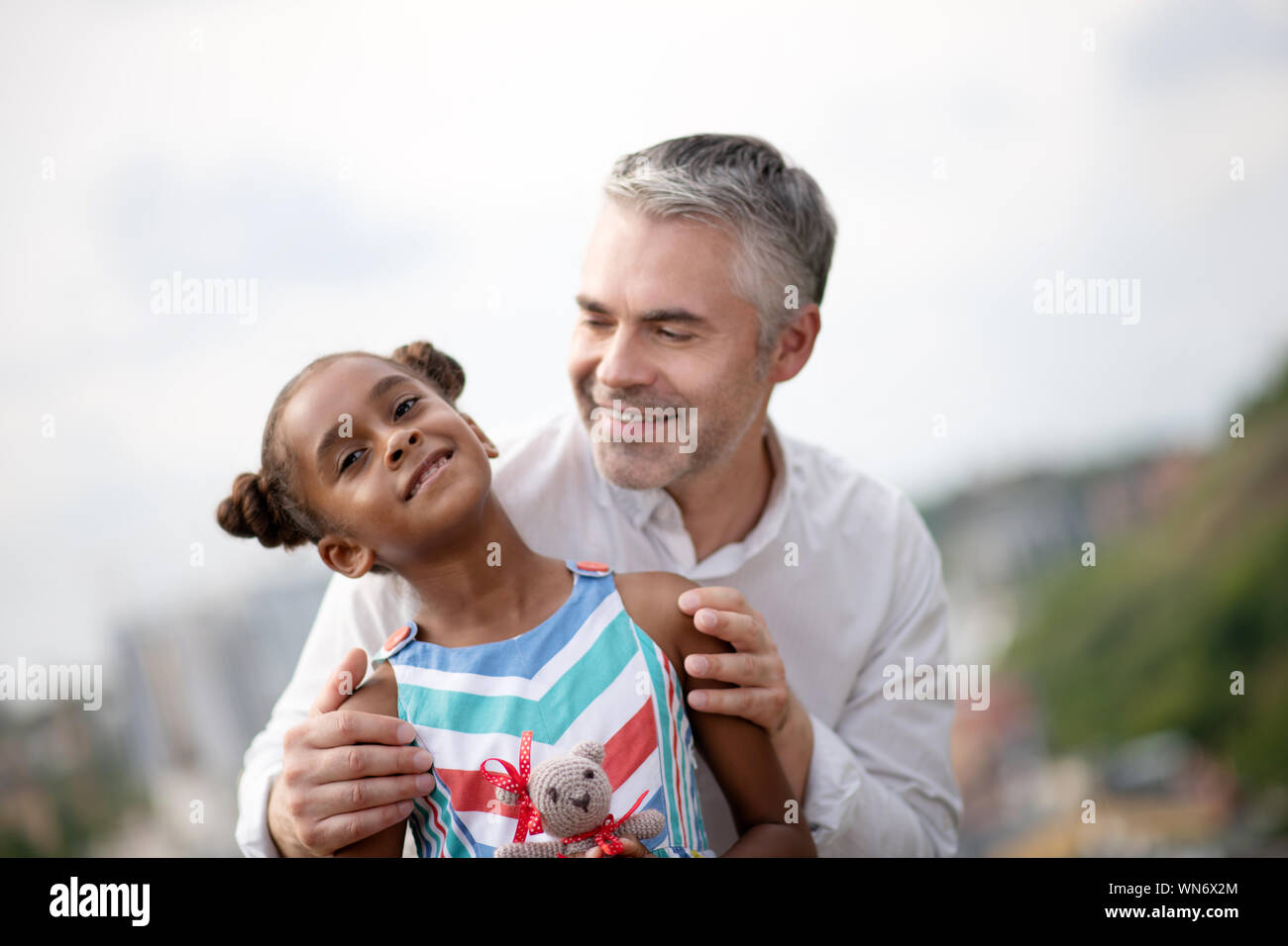 African-American girl spending time with foster daddy Stock Photo