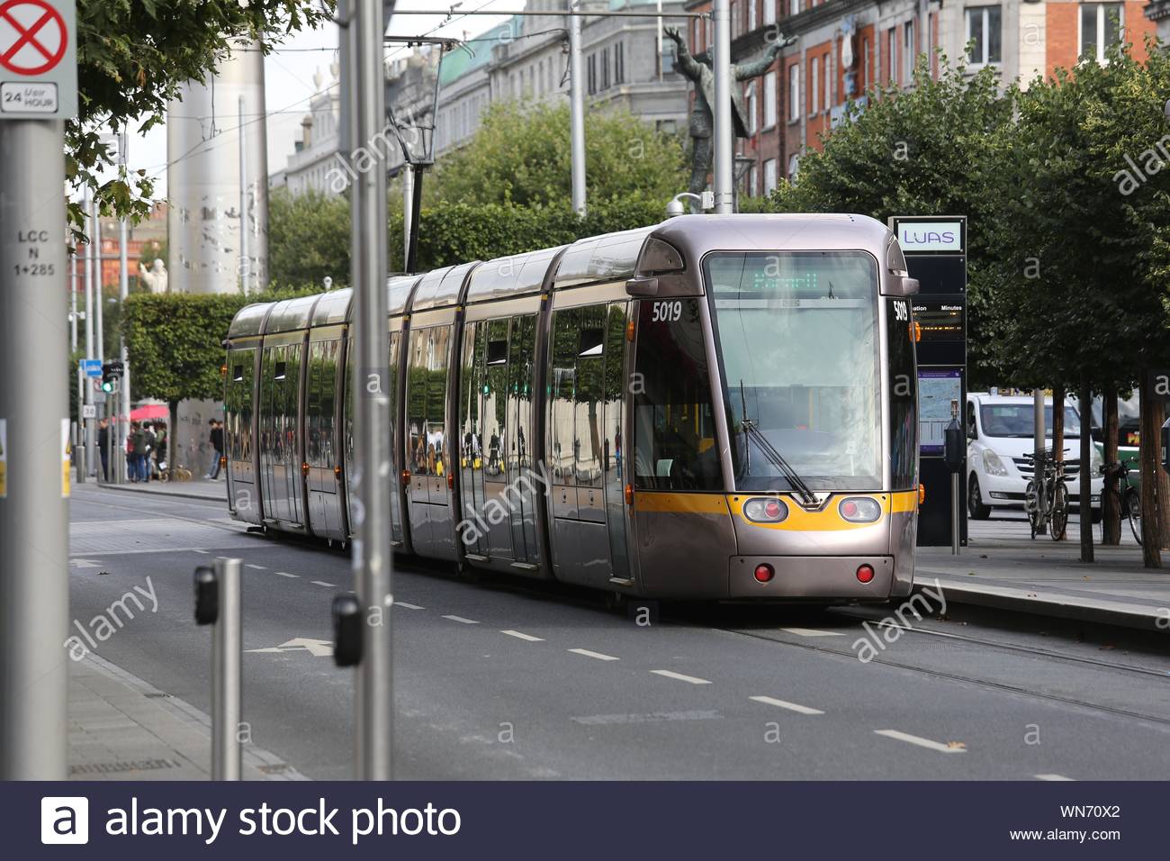 A Luas tram waits to pull off in O'Connell Street Dublin on a pleasant summer's day. Stock Photo