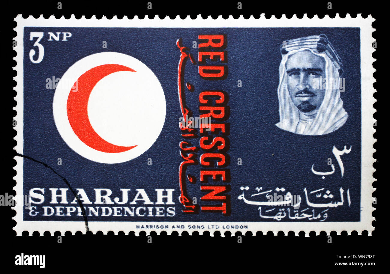 Stamp issued in the Sharjah shows Red Crescent Emblem, portrait of Sheik Saqr bin Sultan al Qasimi, 100 years International Red Cross, circa 1963. Stock Photo