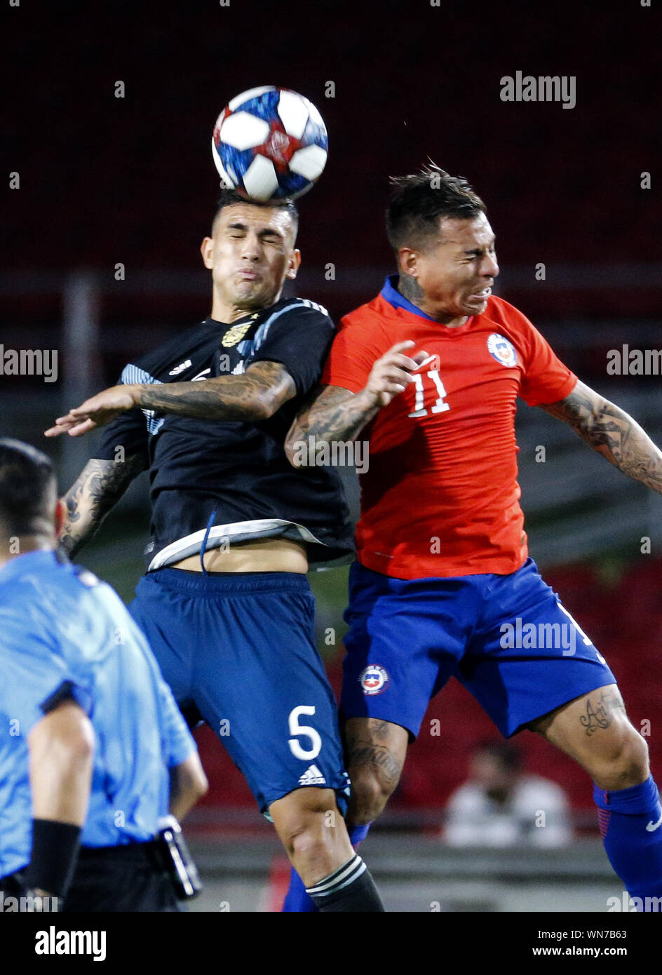 Los Angeles, California, USA. 5th Sep, 2019. Argentina defender German Pezzella (6) and Chile forward Eduardo Vargas (11) fight for the ball during an International Friendly Soccer match between Argentina and Chile at the Los Angeles Memorial Coliseum in Los Angeles on Thursday, September 5, 2019. Credit: Ringo Chiu/ZUMA Wire/Alamy Live News Stock Photo