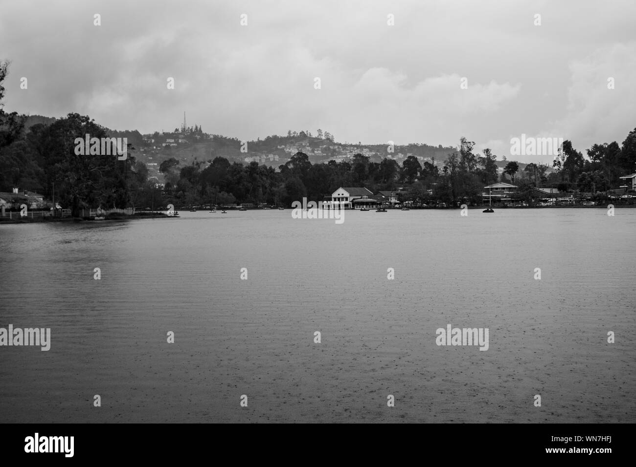 kodaikanal lake view with hill background in black and white image is showing the natural beauty of kodaikanal india. Stock Photo