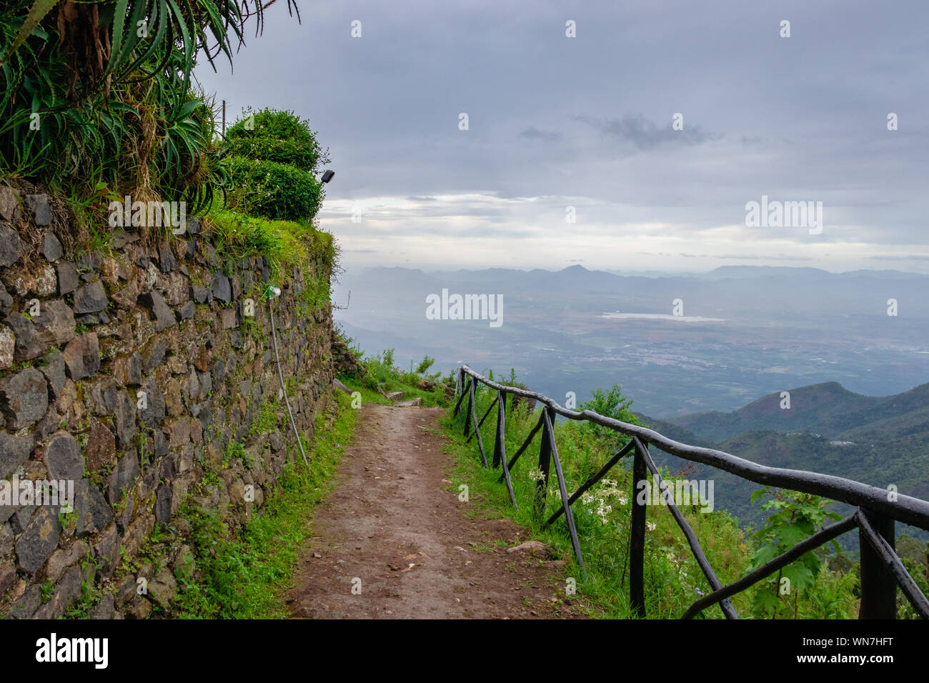 Nature View with leading path amazing landscape Image taken at Kodaikanal tamilnadu India from top of the hill. Image is showing the beautiful nature. Stock Photo