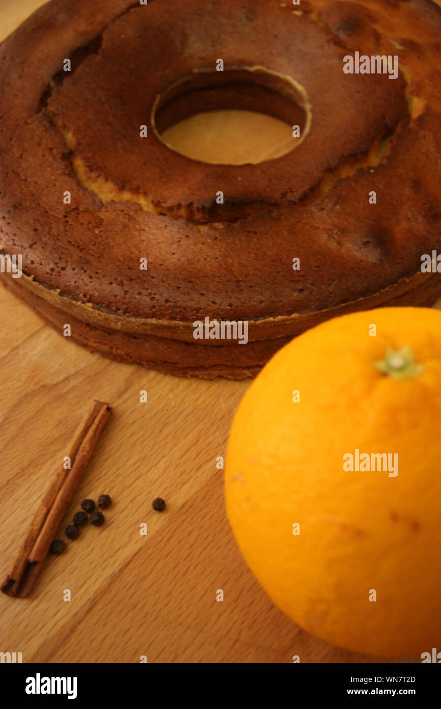 Close-up Of Fresh Cake And Fruit With Spices On Table Stock Photo