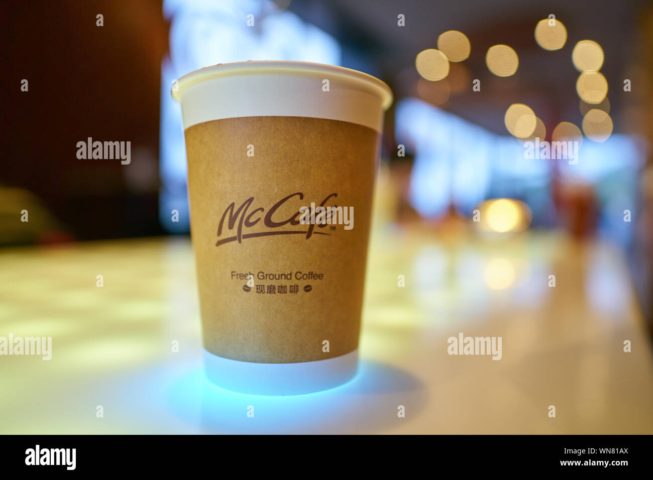 SHENZHEN, CHINA - CIRCA FEBRUARY, 2019: McCafe paper cup on a table at ...