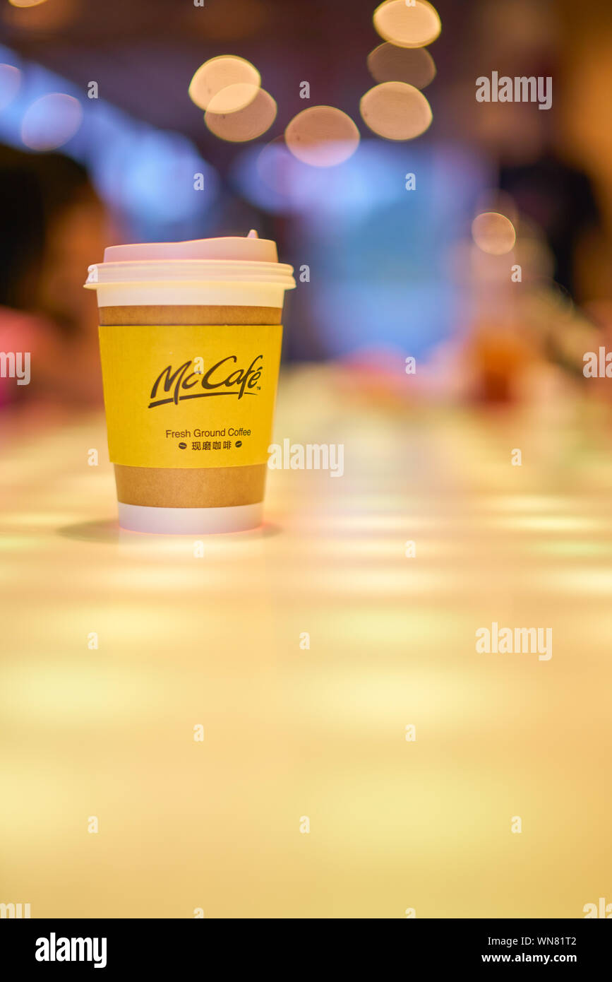 SHENZHEN, CHINA - CIRCA FEBRUARY, 2019: McCafe paper cup on a table at ...
