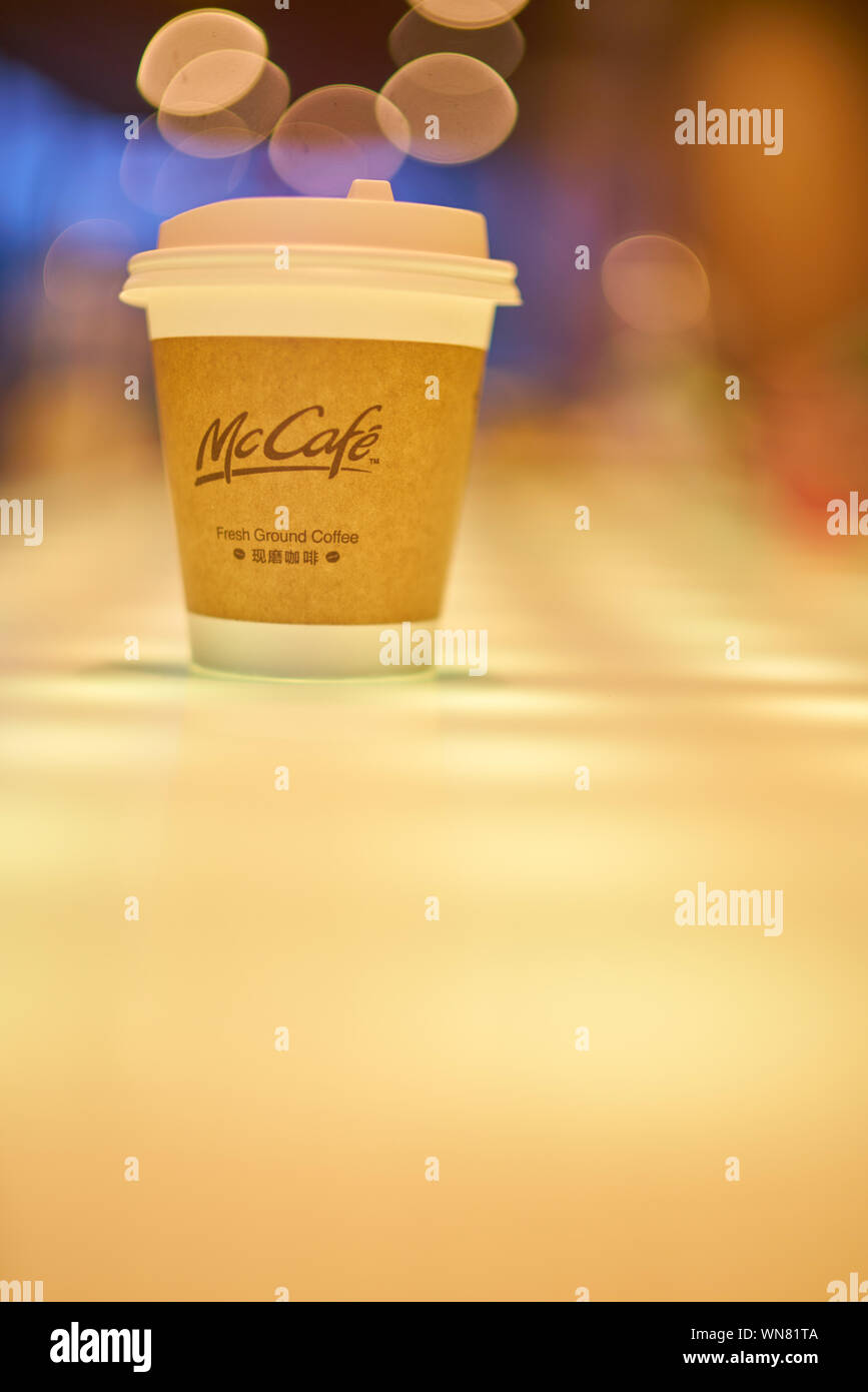 SHENZHEN, CHINA - CIRCA FEBRUARY, 2019: McCafe paper cup on a table at ...