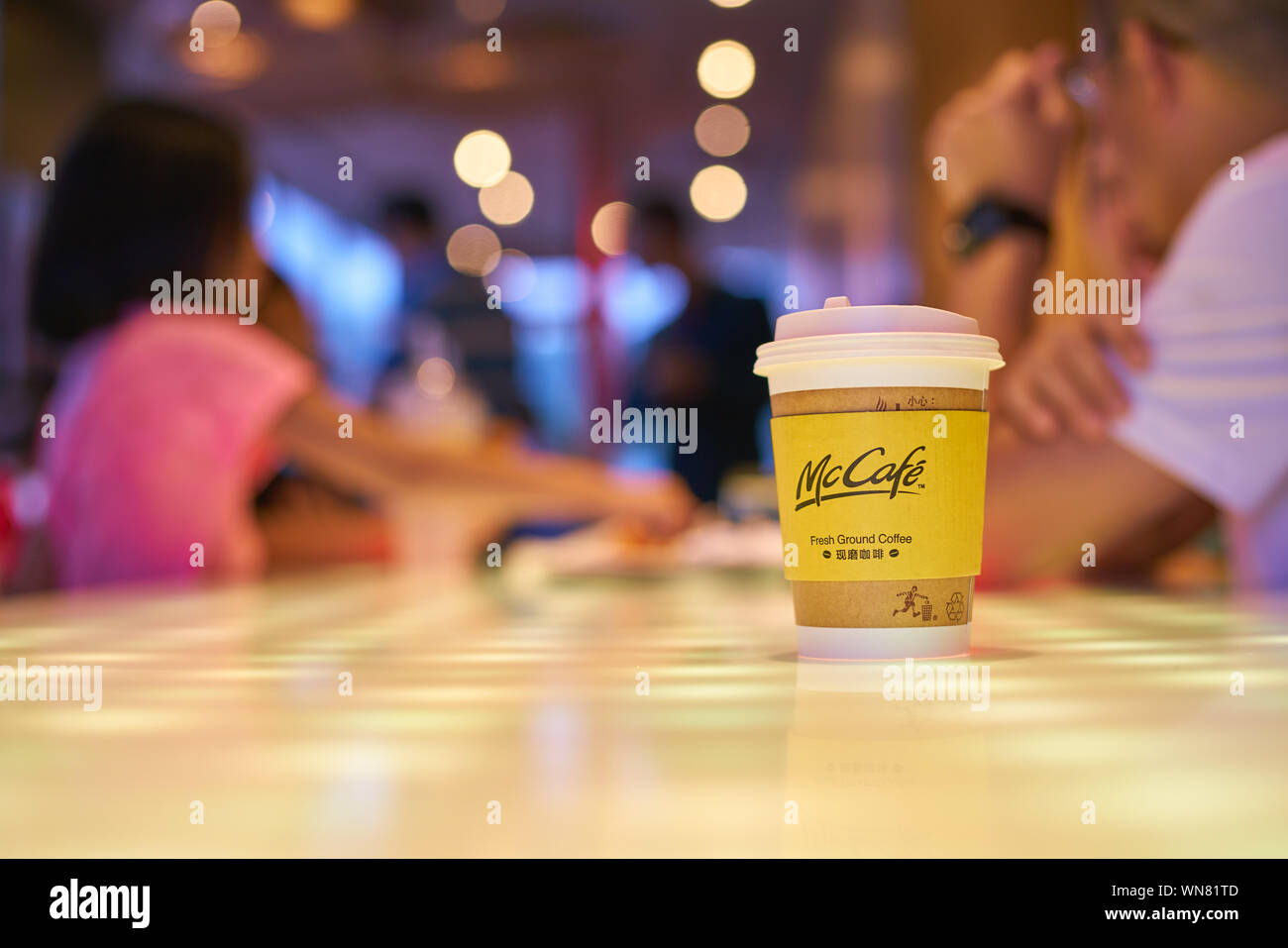 SHENZHEN, CHINA - CIRCA FEBRUARY, 2019: McCafe paper cup on a table at ...