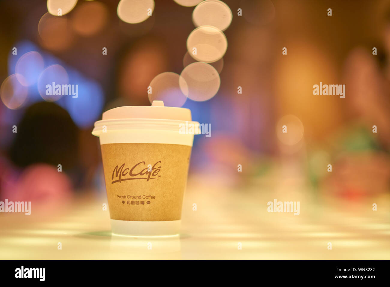 SHENZHEN, CHINA - CIRCA FEBRUARY, 2019: McCafe paper cup on a table at ...