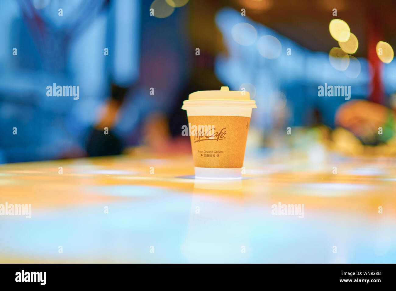 SHENZHEN, CHINA - CIRCA FEBRUARY, 2019: McCafe paper cup on a table at ...