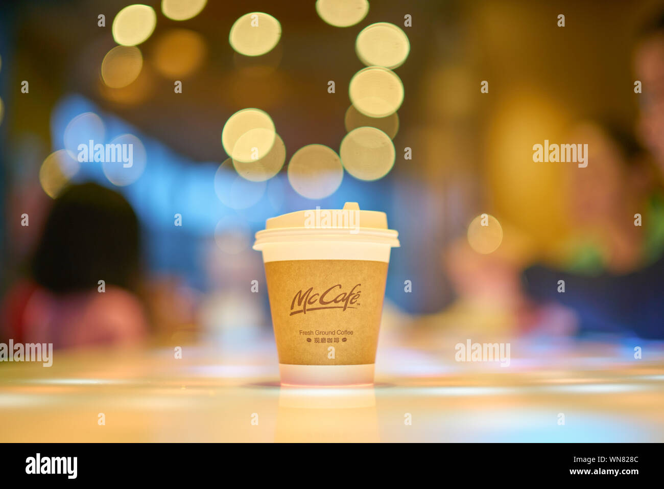 SHENZHEN, CHINA - CIRCA FEBRUARY, 2019: McCafe paper cup on a table at ...