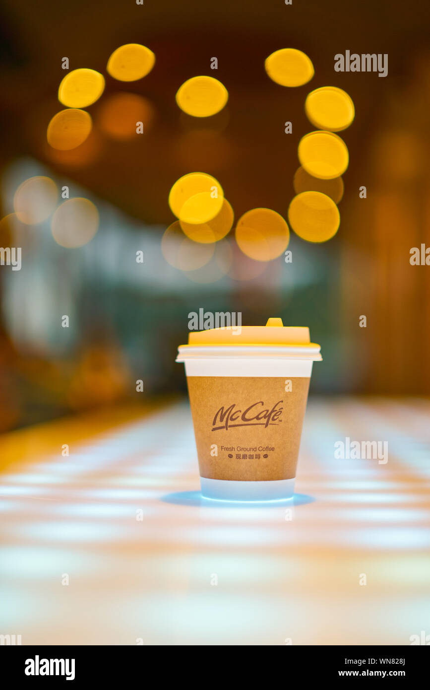 SHENZHEN, CHINA - CIRCA FEBRUARY, 2019: McCafe paper cup on a table at ...