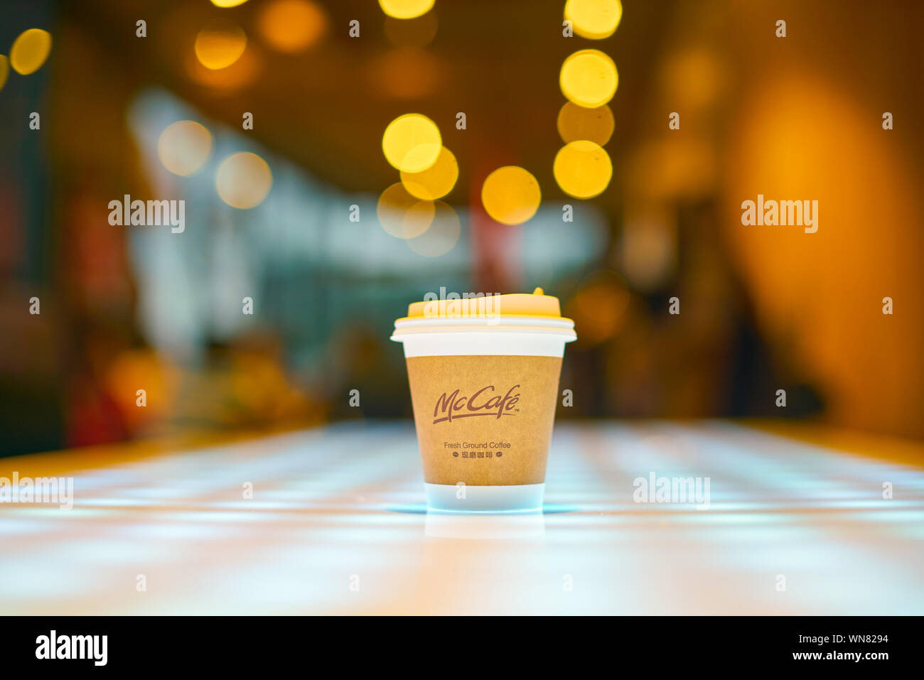 SHENZHEN, CHINA - CIRCA FEBRUARY, 2019: McCafe paper cup on a table at ...
