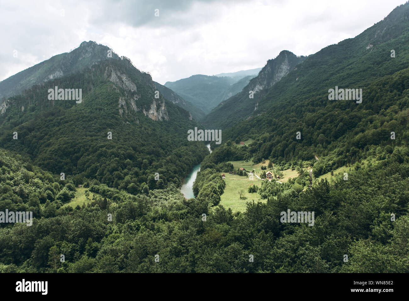 Beautiful view of the natural landscape in the canyon of the Tara River in Montenegro. View of the mountains and the forest and the river. Stock Photo