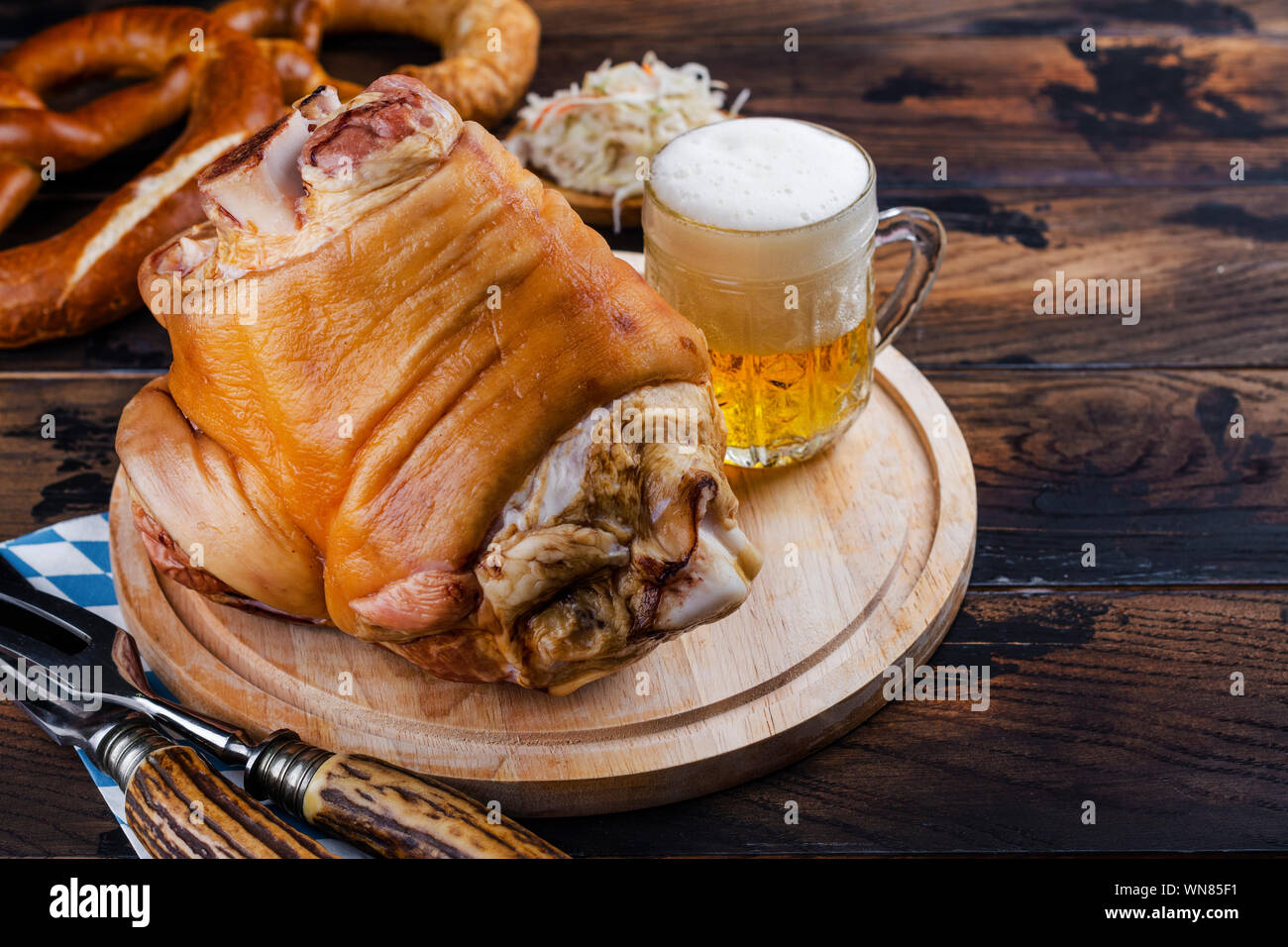 Pork knuckle, beer and pretzels Stock Photo Alamy