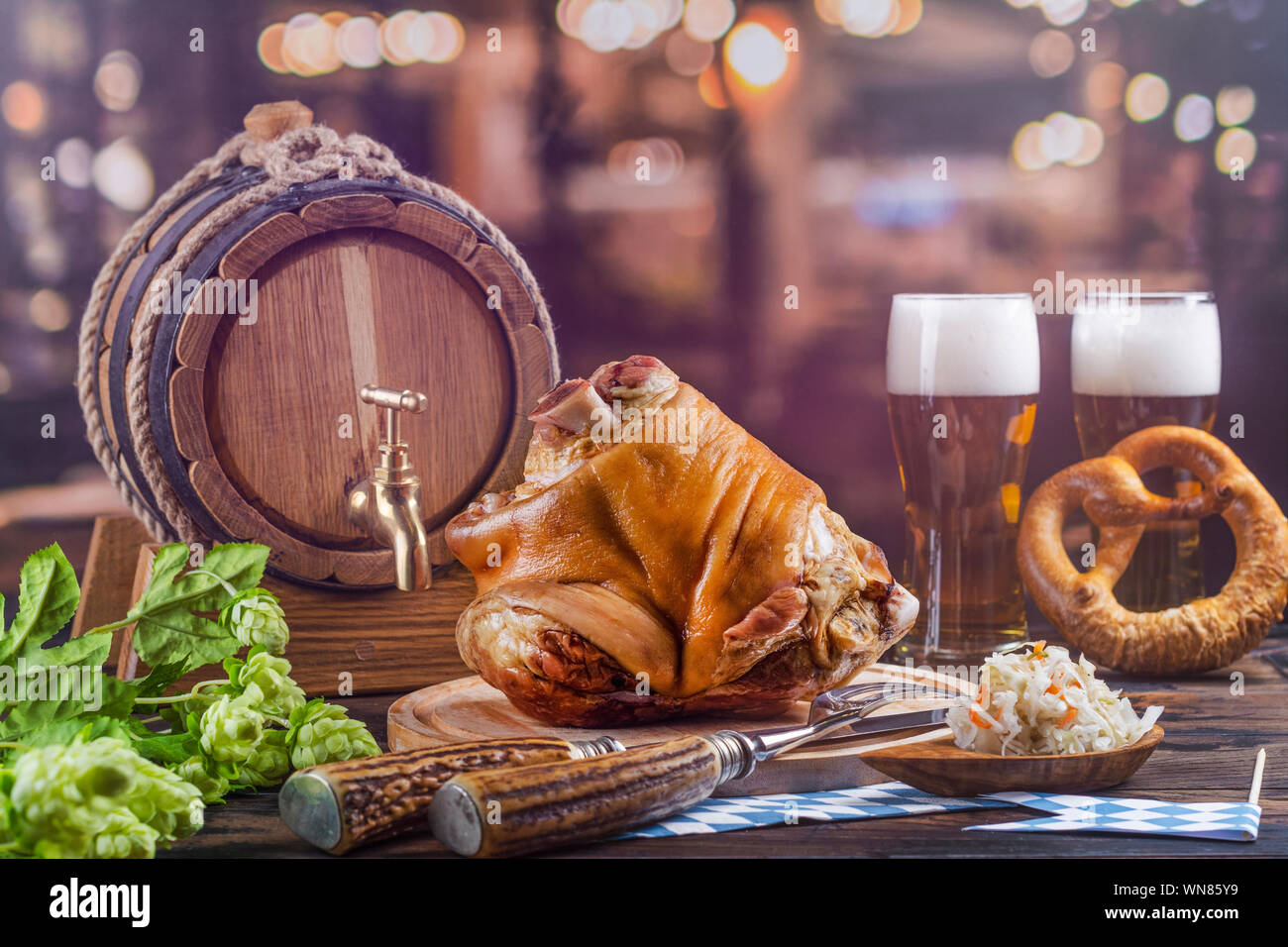 Pork knuckle, beer and pretzels Stock Photo Alamy