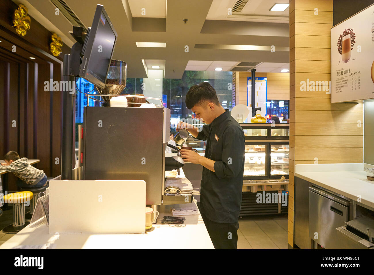 Mccafe Worker SHENZHEN, CHINA - CIRCA FEBRUARY, 2019: worker prepare coffee at McCafe ...