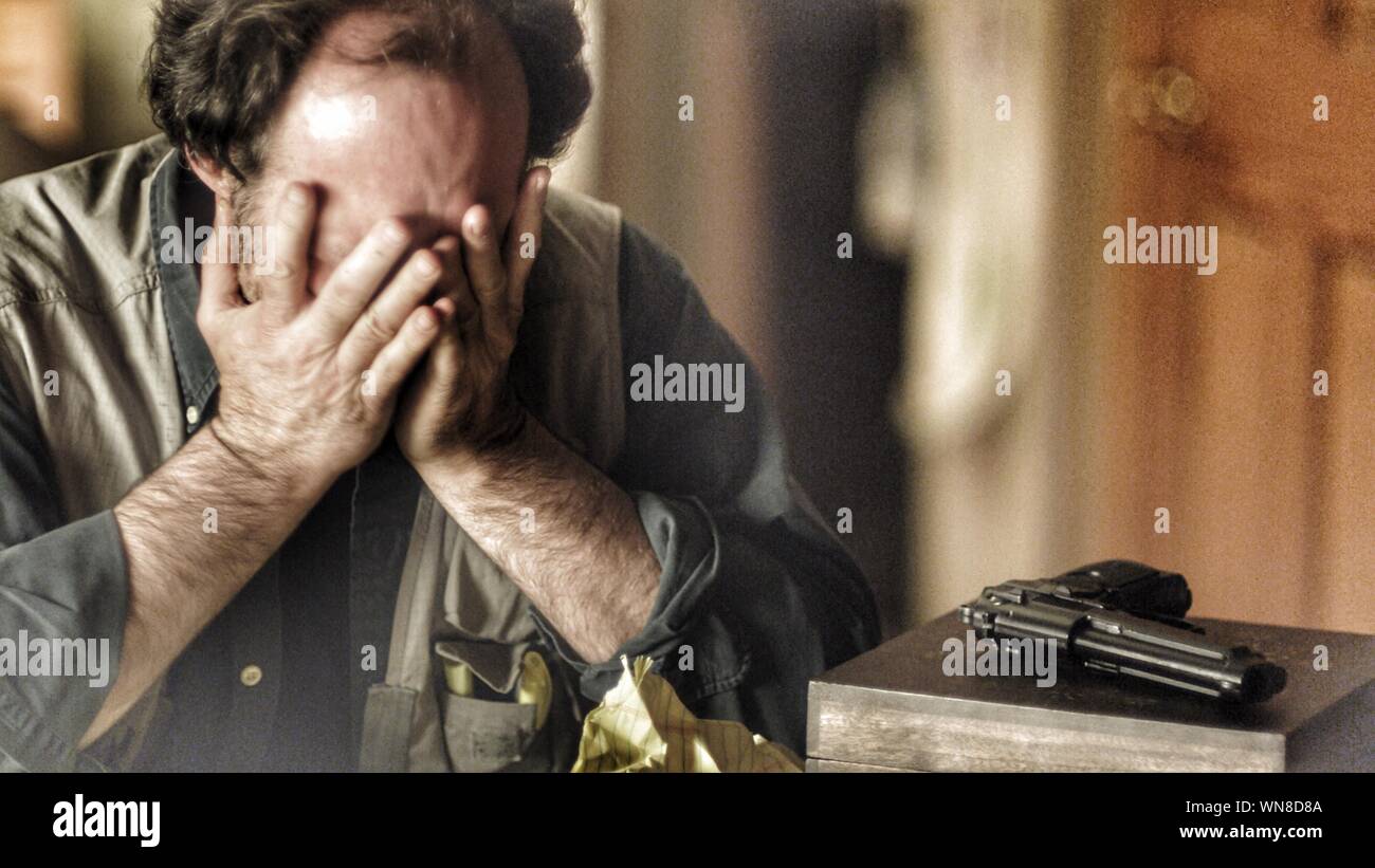 Sad man sitting at home hi-res stock photography and images - Alamy