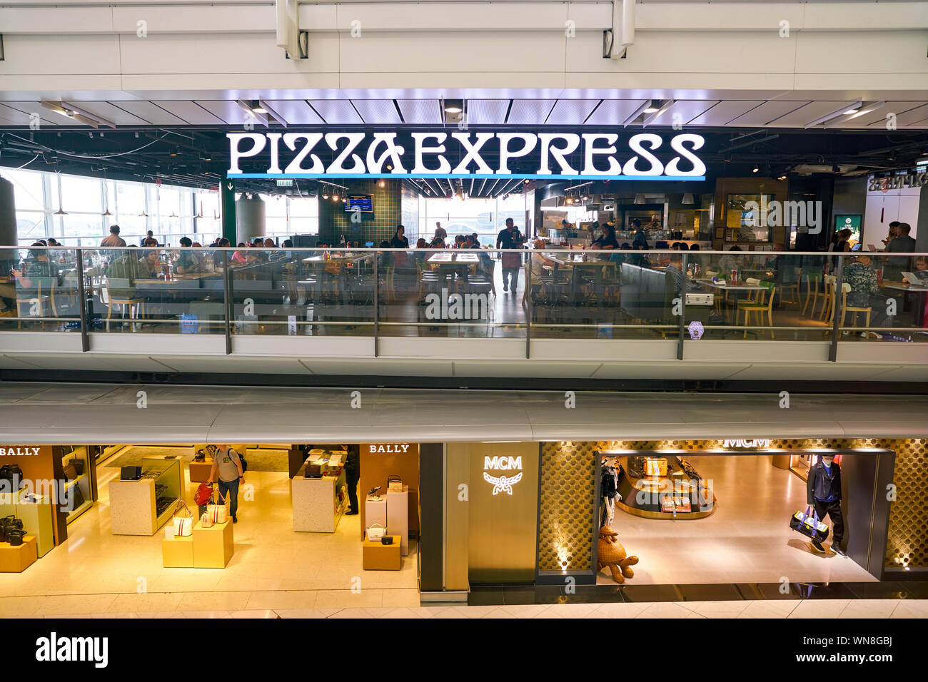 HONG KONG, CHINA - CIRCA FEBRUARY, 2019: PizzaExpress restaurant, Bally and  MCM stores in Hong Kong International Airport Stock Photo - Alamy