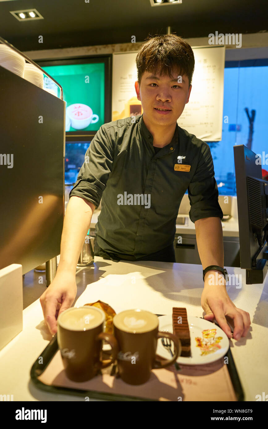 Mccafe Worker SHENZHEN, CHINA - CIRCA FEBRUARY, 2019: indoor portrait of worker at ...