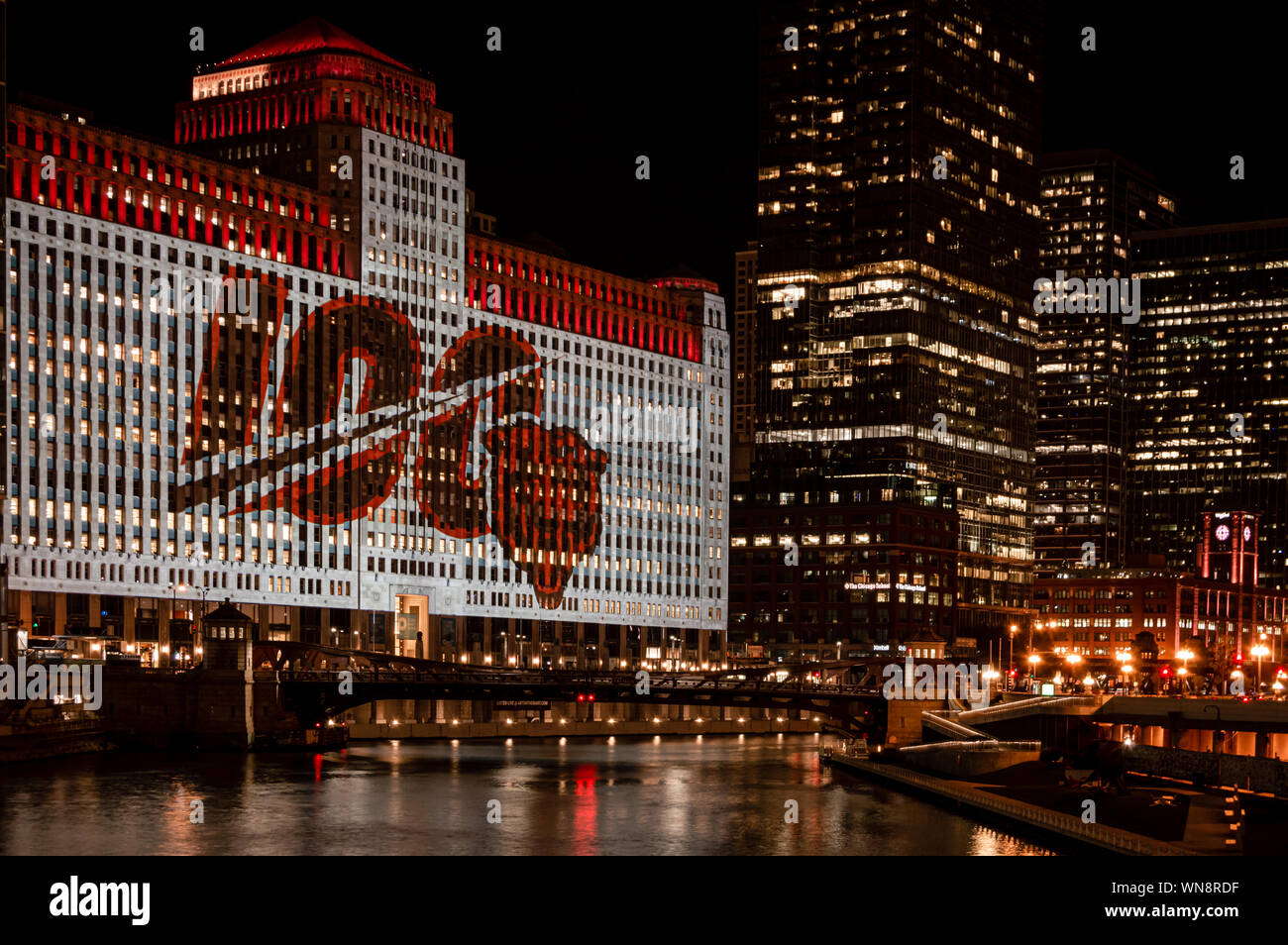 Chicago, USA-September 5, 2019: The Merchandise Mart is celebrating the 100th playing season of the Chicago Bears NFL with projected wall art at night Stock Photo
