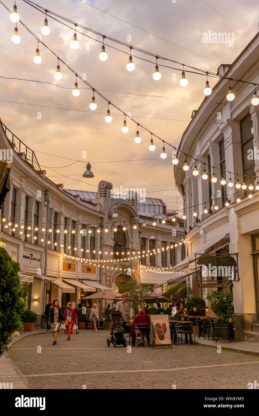 Illuminated street of Cotton Rows in the centre of Tbilisi, capital of Georgia. It is in the area of restaurants and bars, popular among tourists. Stock Photo