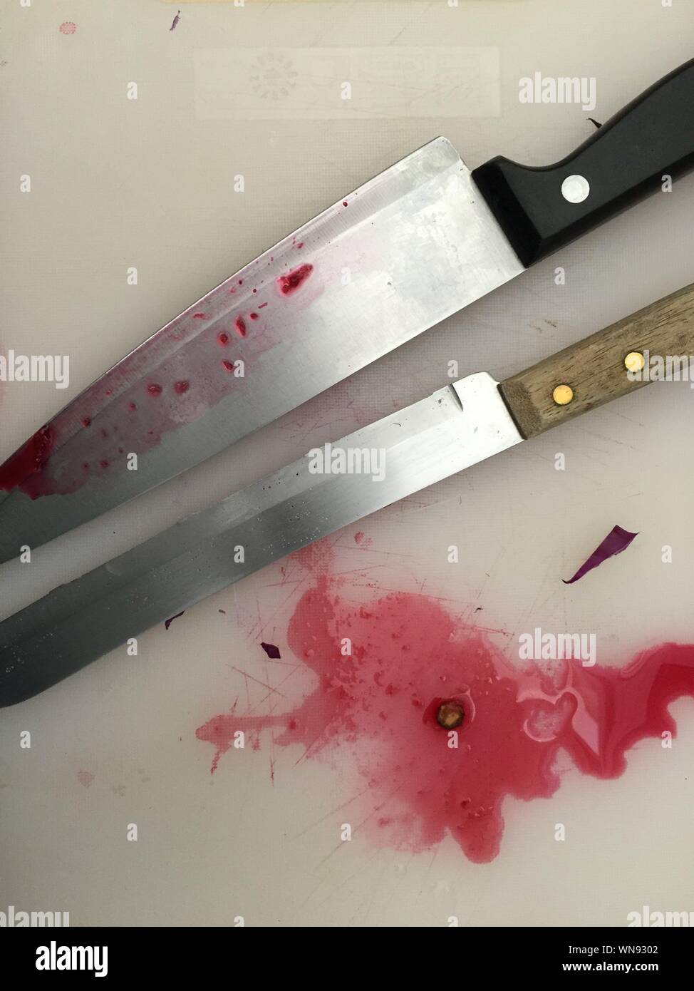 Directly Above View Of Stained Kitchen Knives Stock Photo