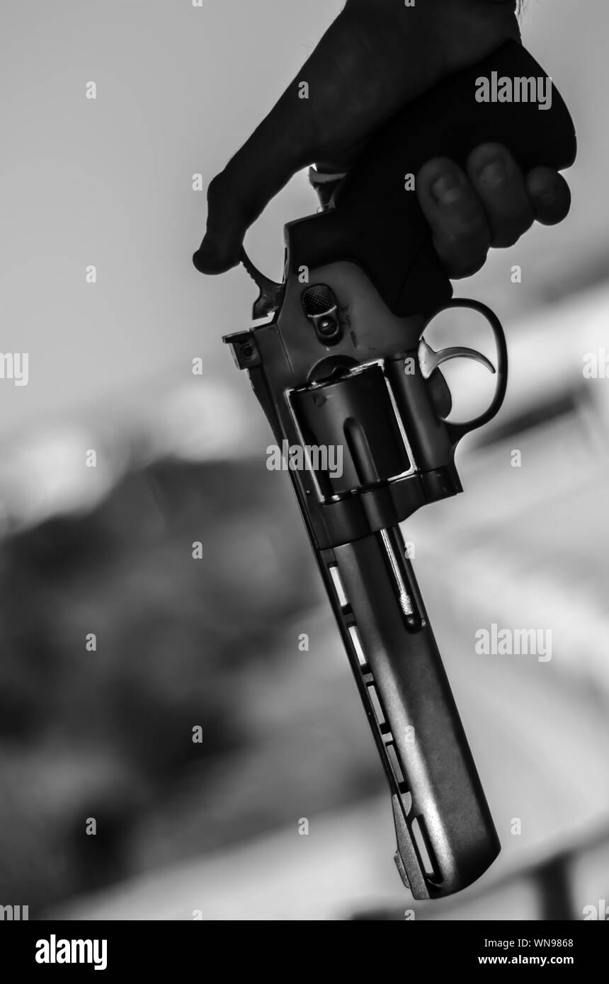 Hand holding gun close up Black and White Stock Photos & Images Alamy