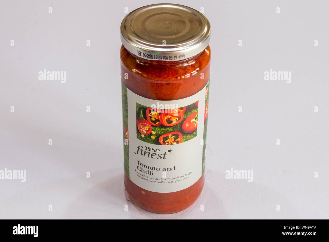 Phuket, Thailand - August 1st 2019: Tesco finest tomato and chilli sauce in a glass jar. Tesco is a major British supermarket chain. Stock Photo
