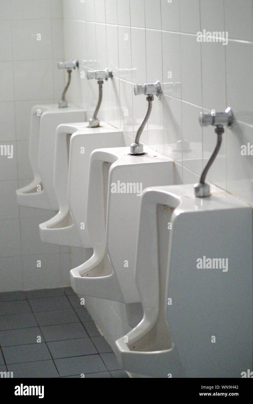 Closeup Of Urinals In Bathroom Stock Photo Alamy