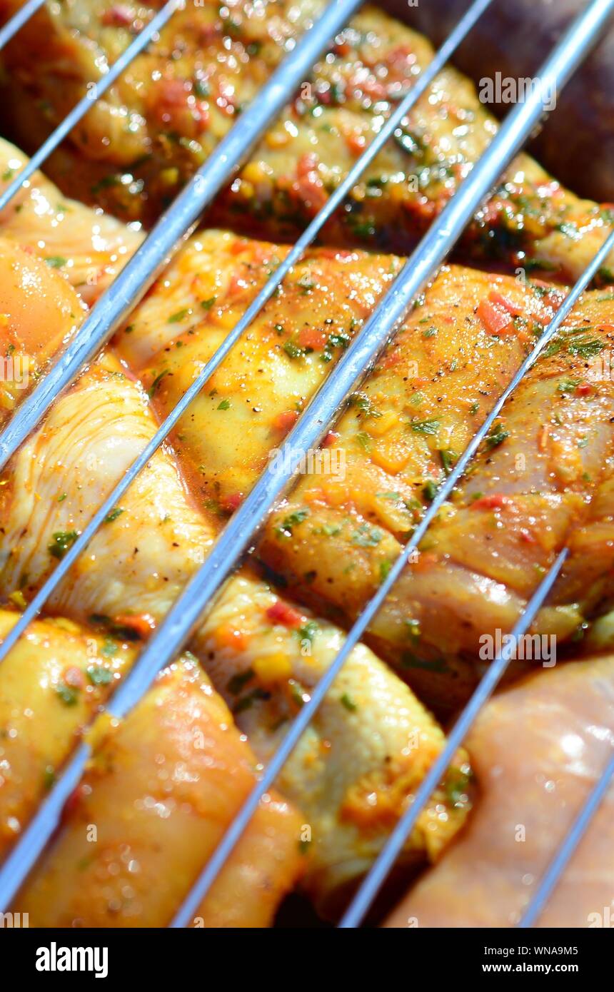 Delicious chicken legs on garden grill. Marinated Chicken Legs On The