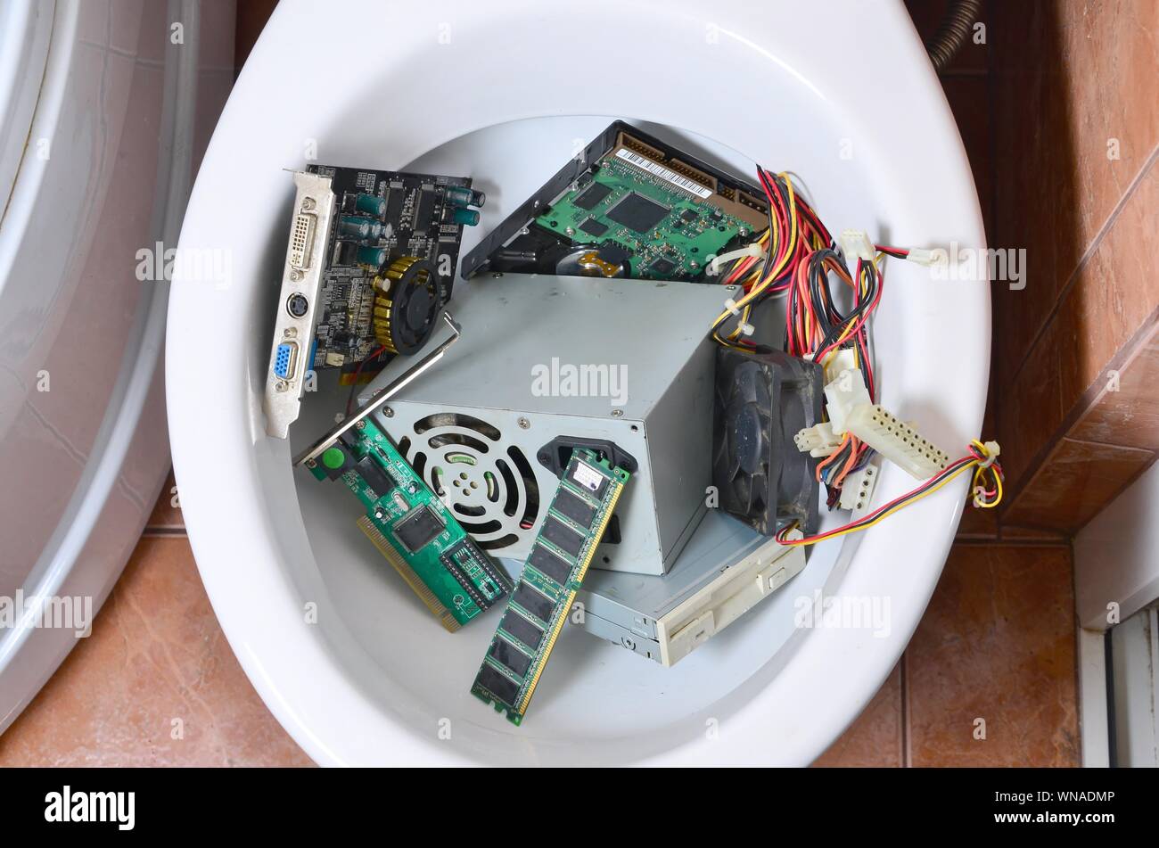old and unused computer details is recycled in toilet bowl metaphoric creative concept stock photo alamy alamy