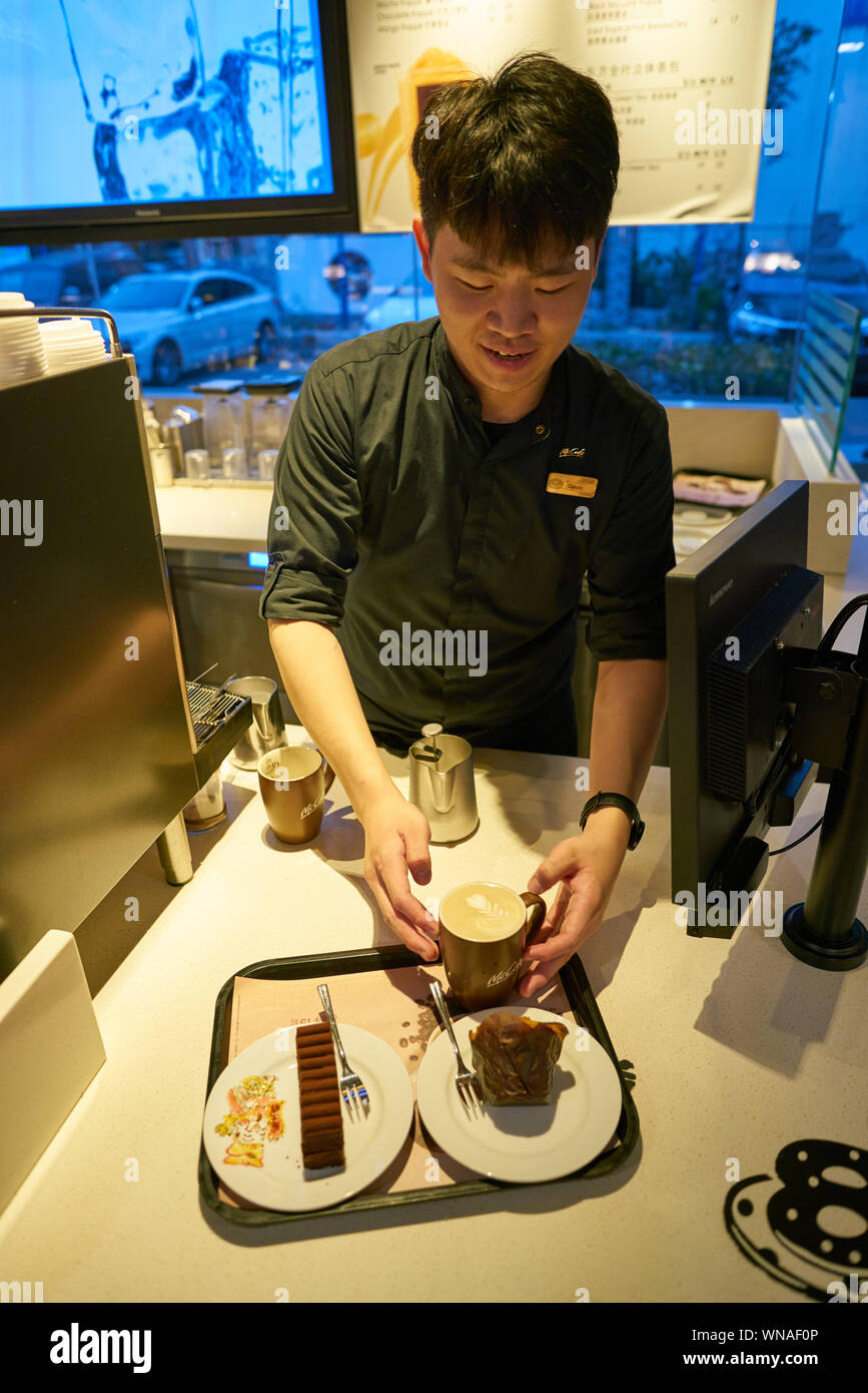Mccafe Worker SHENZHEN, CHINA - CIRCA FEBRUARY, 2019: worker at McCafe in Shenzhen ...