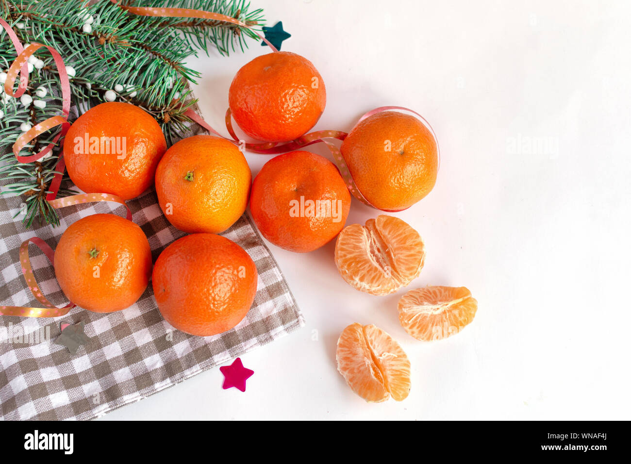 Mandarins fruits top view on white decorated table background. Healthy