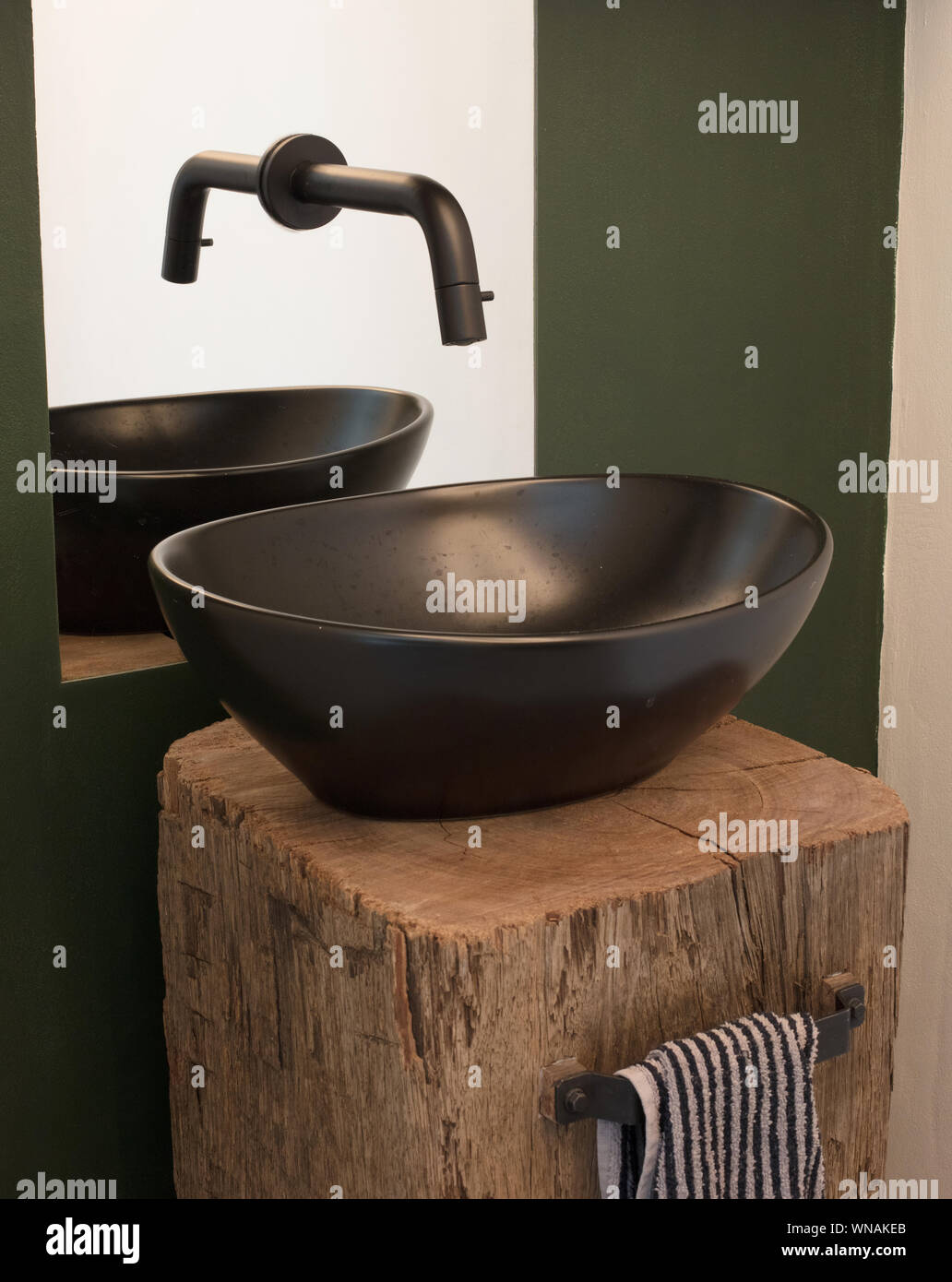 Modern bathroom bowl sink, black bowl, watertap in the mirror Stock ...