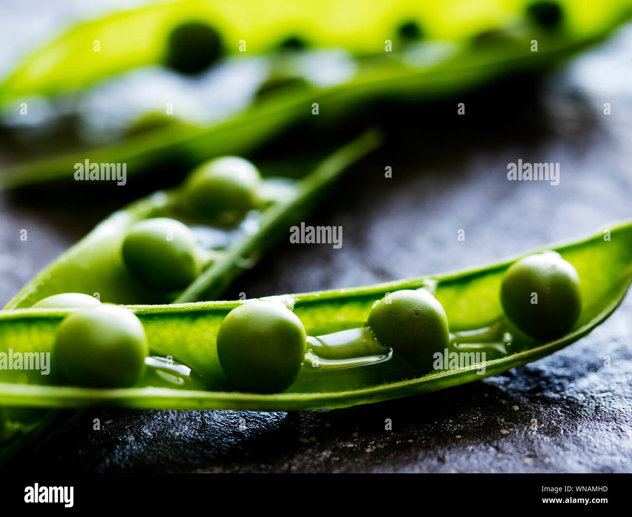Close-up Of Green Peas On Table Stock Photo