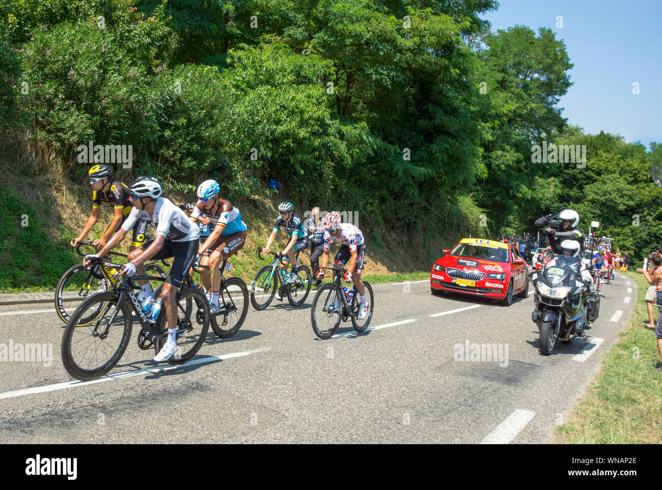 The 2018 Tour de France cycling race.At the back of the peloton near the market town of Maurbourguet. Hautes-Pyrenees.Southwest France. Stock Photo